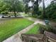 View of a well-manicured front yard from the porch, showcasing the home's curb appeal and serene surroundings at 2351 Carver Nw Dr, Atlanta, GA 30314