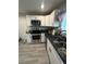 Kitchen featuring white cabinets, stainless steel appliances, and granite countertops at 2351 Carver Nw Dr, Atlanta, GA 30314