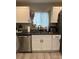 A stainless steel sink with granite countertops and white cabinets at 2351 Carver Nw Dr, Atlanta, GA 30314