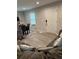 Comfortable living room with hardwood-style floors, a gray sectional couch, and natural light from a window at 2351 Carver Nw Dr, Atlanta, GA 30314