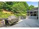 View of the expansive deck and backyard, providing a serene outdoor retreat with landscaping at 3185 Country Club Nw Ct, Kennesaw, GA 30144