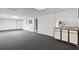Basement area with gray carpeting, white walls, recessed lighting, and a small refreshment center at 3185 Country Club Nw Ct, Kennesaw, GA 30144