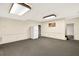 Basement featuring neutral walls, gray carpeting, recessed lighting, and a white refrigerator at 3185 Country Club Nw Ct, Kennesaw, GA 30144