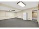 Spacious basement with gray carpeting, a white refrigerator, and neutral-colored walls at 3185 Country Club Nw Ct, Kennesaw, GA 30144