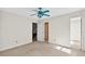 Bedroom with ceiling fan and two doorways at 3185 Country Club Nw Ct, Kennesaw, GA 30144