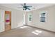Bright bedroom with neutral walls and a view into an adjacent room at 3185 Country Club Nw Ct, Kennesaw, GA 30144