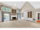 Spacious living room with a brick fireplace and built in shelves at 3185 Country Club Nw Ct, Kennesaw, GA 30144