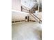 Open-concept living room with staircase and elegant trim at 3185 Country Club Nw Ct, Kennesaw, GA 30144