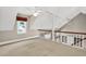 Loft space with multiple ceiling fans, white railing, and lots of natural light at 3185 Country Club Nw Ct, Kennesaw, GA 30144