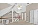 Loft space with multiple ceiling fans and white railing at 3185 Country Club Nw Ct, Kennesaw, GA 30144