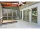 Enclosed porch featuring vaulted ceiling, hot tub, and lattice, providing privacy and comfort at 3185 Country Club Nw Ct, Kennesaw, GA 30144