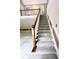 Carpeted staircase with wooden railing at 3185 Country Club Nw Ct, Kennesaw, GA 30144