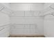 Empty walk-in closet with white wire shelving at 3185 Country Club Nw Ct, Kennesaw, GA 30144