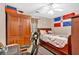 Bedroom featuring hardwood floors, a ceiling fan, and neutral decor at 3902 Cedarwoods Way, Lawrenceville, GA 30044