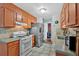 Well-equipped kitchen featuring stainless steel appliances, tile floors, and ample cabinet space at 3902 Cedarwoods Way, Lawrenceville, GA 30044