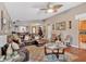 Cozy living room featuring hardwood floors, a ceiling fan, and comfortable seating at 3902 Cedarwoods Way, Lawrenceville, GA 30044