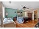 Inviting primary bedroom featuring hardwood floors, a ceiling fan, and a closet at 3902 Cedarwoods Way, Lawrenceville, GA 30044