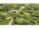 Discover a unique property: aerial view featuring mature trees and an adjacent commercial building at 3961 Jodeco Rd, Mcdonough, GA 30253