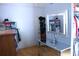 Organized walk-in closet with ample storage, a vanity with a mirror, and hardwood flooring at 3961 Jodeco Rd, Mcdonough, GA 30253