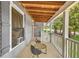 Cozy covered front porch with outdoor seating at 3961 Jodeco Rd, Mcdonough, GA 30253