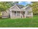 Inviting one-story home with a covered front porch, perfect for relaxing outdoors at 3961 Jodeco Rd, Mcdonough, GA 30253