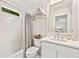 Bright bathroom with white subway tiles, a shower/tub combo, and a vanity at 54 Camden Ne Rd, Atlanta, GA 30309