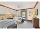 Charming bedroom with two twin beds, stylish decor, and a ceiling fan offers a cozy and inviting atmosphere at 54 Camden Ne Rd, Atlanta, GA 30309