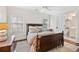 Cozy bedroom with wood frame bed, dark wood floors, and an attached bathroom at 54 Camden Ne Rd, Atlanta, GA 30309