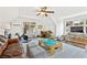Bright bonus room featuring a ceiling fan, play area, desk, peloton bike and comfortable seating at 54 Camden Ne Rd, Atlanta, GA 30309