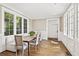 Breakfast nook with bench seating, natural light, and hardwood floors at 54 Camden Ne Rd, Atlanta, GA 30309