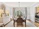 Bright dining room featuring a dining table, six chairs, a chandelier and beautiful natural light at 54 Camden Ne Rd, Atlanta, GA 30309