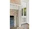 Detailed view of the brick fireplace with white mantle and adjacent window at 54 Camden Ne Rd, Atlanta, GA 30309