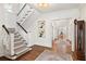 Bright foyer featuring a staircase, hardwood floors, and views into adjoining rooms at 54 Camden Ne Rd, Atlanta, GA 30309