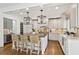 Bright kitchen with stainless steel appliances, white cabinetry, and a center island with seating at 54 Camden Ne Rd, Atlanta, GA 30309