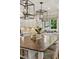 Kitchen island with seating, pendant lights, and stainless steel appliances at 54 Camden Ne Rd, Atlanta, GA 30309
