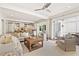 Open concept living room and kitchen area with comfortable seating and access to the outdoor space at 54 Camden Ne Rd, Atlanta, GA 30309