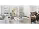 Open living area with fireplace, piano, neutral furniture, and access to other rooms at 54 Camden Ne Rd, Atlanta, GA 30309