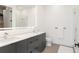 Bathroom with double sink vanity, quartz countertop, framed mirror, and glass shower enclosure at 788 W Marietta St # 1809, Atlanta, GA 30318