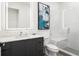 Modern bathroom with white subway tile shower and glass door, sleek vanity, and illuminated mirror at 788 W Marietta St # 1809, Atlanta, GA 30318