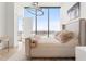 Bedroom with a large window offering scenic views and modern lighting at 788 W Marietta St # 1809, Atlanta, GA 30318