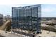 Modern high-rise condominium building exterior featuring sleek design, and urban living at 788 W Marietta St # 1809, Atlanta, GA 30318