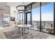 Dining room with a chandelier and expansive windows showcasing city views at 788 W Marietta St # 1809, Atlanta, GA 30318