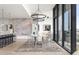 Dining area with stylish lighting, sleek chairs, and expansive windows with city views at 788 W Marietta St # 1809, Atlanta, GA 30318