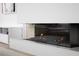 Close-up of a modern fireplace with glass enclosure, adding a touch of elegance to the living space at 788 W Marietta St # 1809, Atlanta, GA 30318