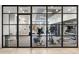 Well-equipped fitness center with glass walls, modern equipment, and ample workout space at 788 W Marietta St # 1809, Atlanta, GA 30318