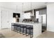 Modern kitchen with a large center island, stainless steel appliances, and stylish pendant lighting at 788 W Marietta St # 1809, Atlanta, GA 30318