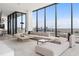 Contemporary living area with floor-to-ceiling windows offering stunning city views and lots of natural light at 788 W Marietta St # 1809, Atlanta, GA 30318