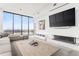 Sunlit living room with floor-to-ceiling windows, a modern fireplace, and an open concept layout at 788 W Marietta St # 1809, Atlanta, GA 30318