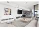 Elegant living room with modern fireplace, flat screen TV, and open layout leading to the dining area at 788 W Marietta St # 1809, Atlanta, GA 30318