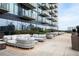 Stylish condo patio featuring comfortable seating with decorative planters and garden at 788 W Marietta St # 1809, Atlanta, GA 30318